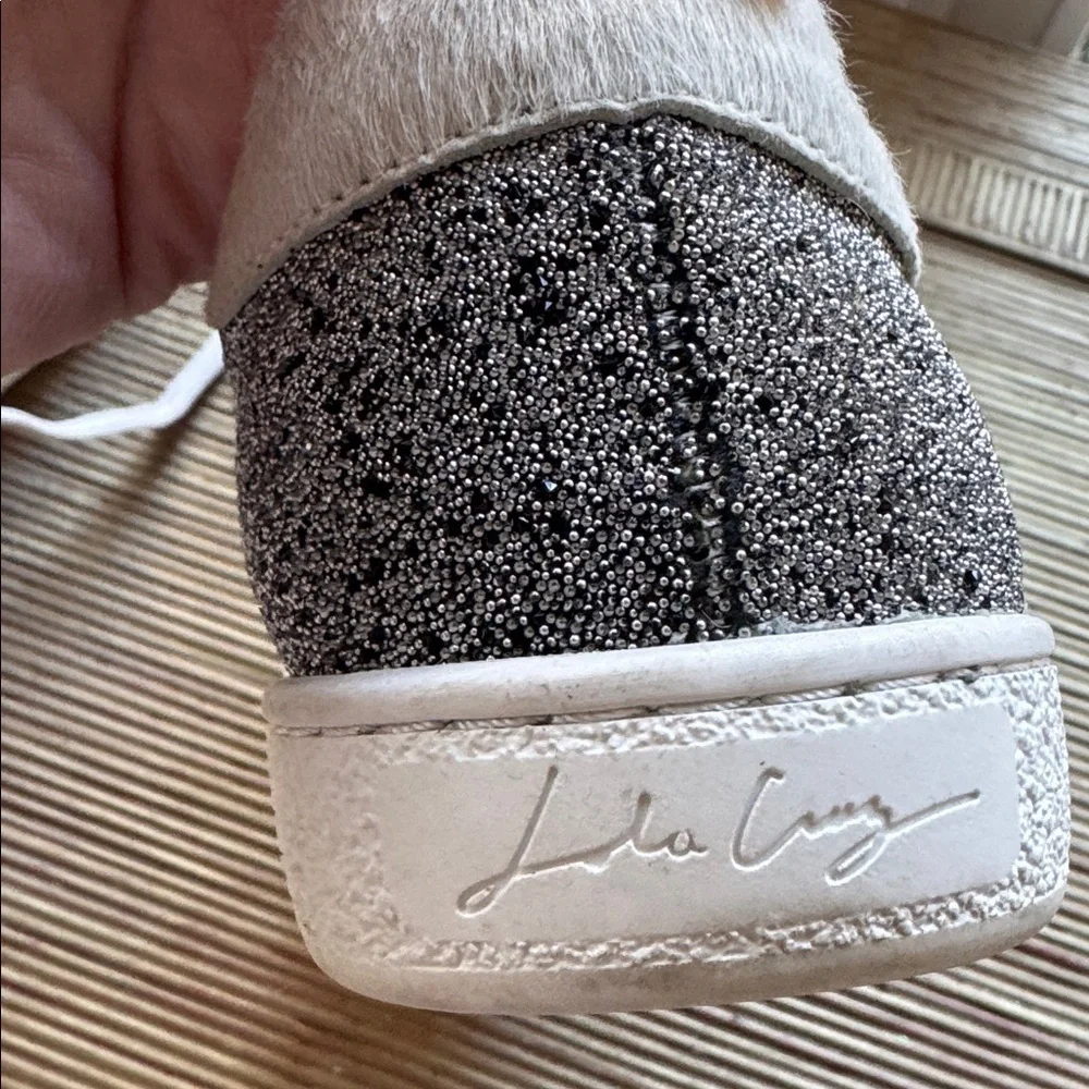 Lola Cruz silver metallic sneakers with a black raised star